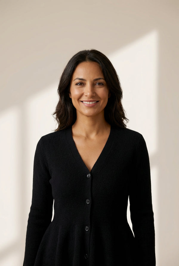 Women's V-Neck Button-Down Peplum Knit Sweater in Midnight Black made for easy styling and wardrobe coordination, with premium-like structure and