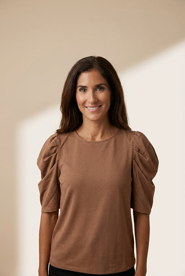 Women's Puff Sleeve Knit Blouse with Ruched Shoulders made for easy styling and wardrobe coordination, with premium-like structure and finish.