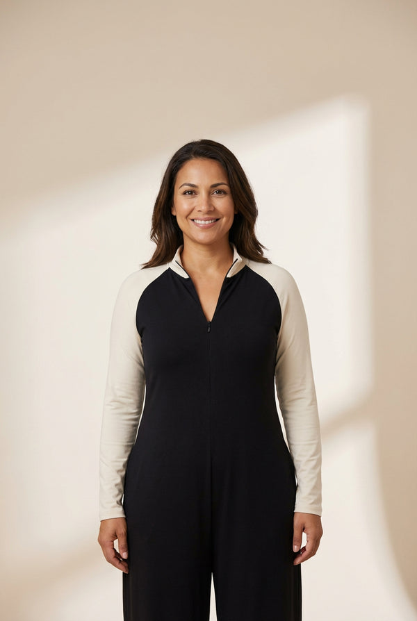women's two-tone half-zip long sleeve romper in black and cream made for easy styling and wardrobe coordination, with premium-like structure and with