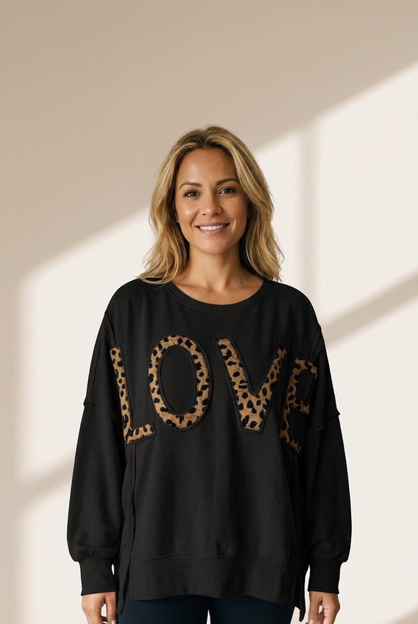 Women's Black Oversized Leopard LOVE Graphic Pullover Sweatshirt made for easy styling and wardrobe coordination, with premium-like structure and