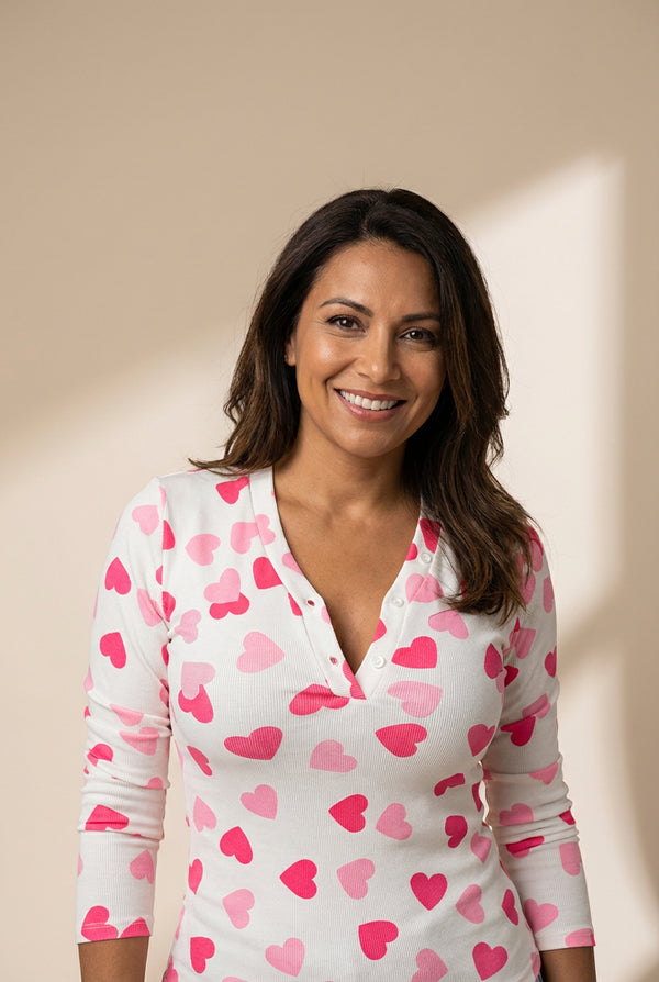 women's fitted pink heart print long sleeve top with buttoned neckline