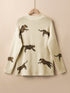 parchment-lively-cheetah-print-high-neck-split-hem-sweater