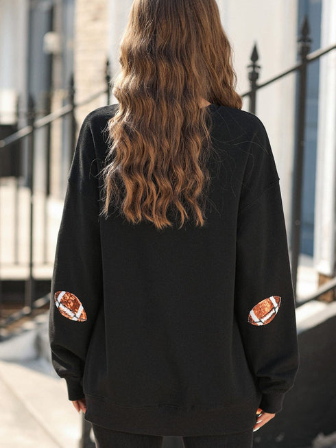 Shimmering Black Sequin Rugby Graphic Sweater