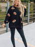 Shimmering Black Sequin Rugby Graphic Sweater