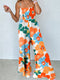 Sunny Floral Spaghetti Strap Smocked Wide Leg Jumpsuit