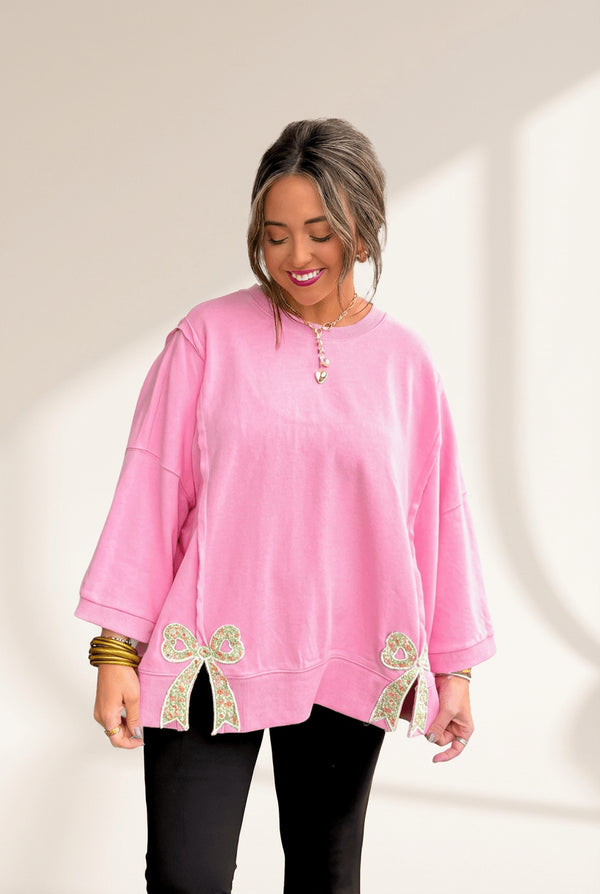 Women's Pink Floral Bow Sweatshirt with Exposed Seams and Slits with practical styling and dependable silhouette control.