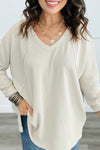 Trendy Women's White Twisted Ribbed Long Sleeve V-Neck Top with Exposed Seams - Chic Style for Any Occasion