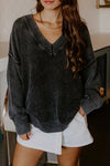 Cozy Women's Black V-Neck Knit Sweater with Exposed Seams & Drop Shoulders - Relaxed Fit for Effortless Style