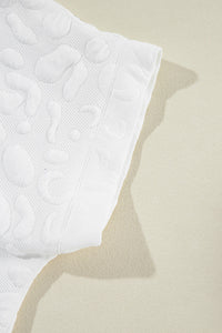 white-leopard-jacquard-quarter-zip-tee-and-shorts-set