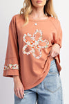 Trendy Women's Grapefruit Orange Graphic Tee with Flower Patch, Exposed Seams & Wide Sleeves for Casual Chic Style