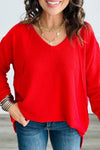 Trendy Women's Fiery Red Long Sleeve V-Neck Top with Twisted Ribbed Design and Exposed Seams for Chic Style