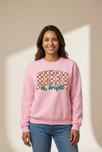 Women's Pink Merry and Bright Checkered Holiday Sweatshirt with practical styling and dependable silhouette control.