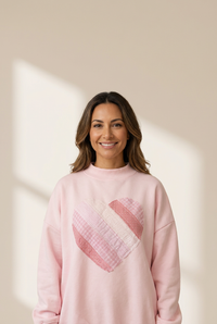 cozy women's light pink oversized mockneck sweatshirt with charming sweetheart patchwork design for casual chic style made for easy styling and with