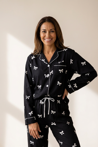 elegant women's black bow print two-piece pajama set for cozy nights and lazy mornings in soft, breathable fabric with practical styling and