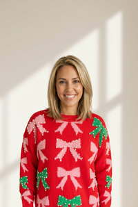 fiery red women's christmas sweater with bow and pearl detail elegant festive holiday style for a flattering fit made for easy styling and wardrobe