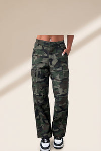 Stylish women's green camouflage loose fit pants with button flap pockets and trendy patch accents