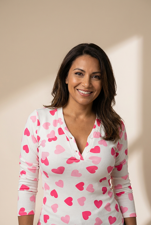 women's fitted pink heart print long sleeve top with buttoned neckline