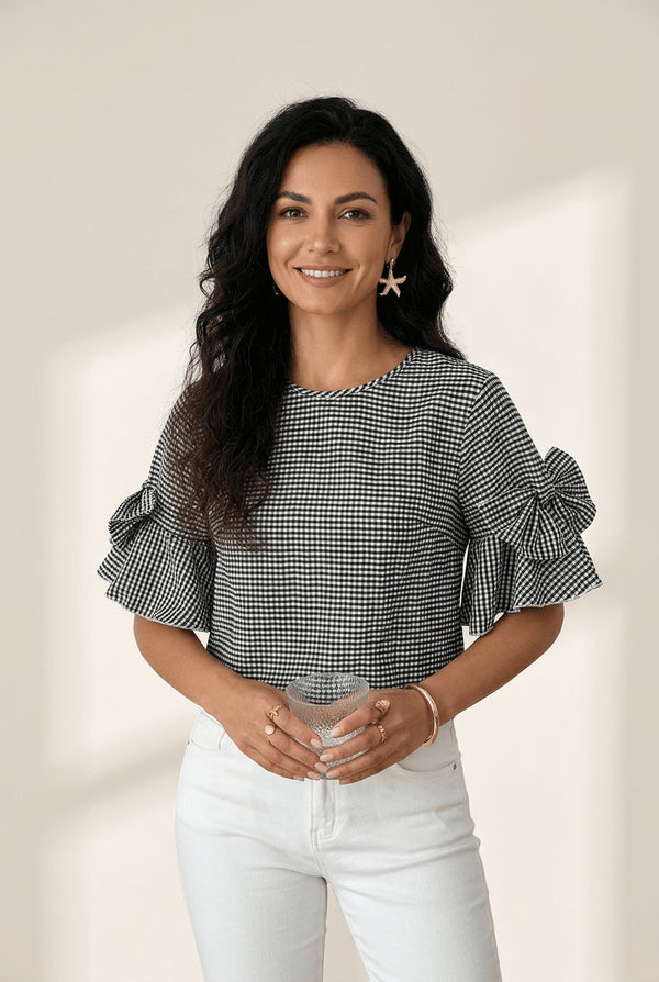 women's black gingham ruffled bow blouse with half sleeves made for easy styling and wardrobe coordination, with premium-like structure and finish.