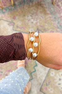 Gold Pearl Embellished Hollowed Waves Plated Bracelet