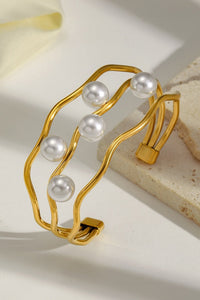 Gold Pearl Embellished Hollowed Waves Plated Bracelet