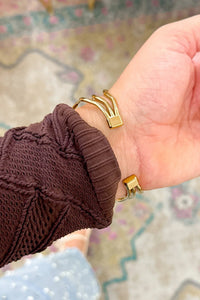 Gold Pearl Embellished Hollowed Waves Plated Bracelet