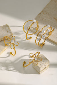 Gold Pearl Embellished Hollowed Waves Plated Bracelet