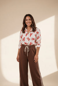 Cinnamon wide leg women's pants with varsity stripes and comfortable drawstring waist for effortless style made for easy styling and wardrobe with