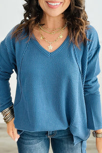 
Trendy Women's Peacock Blue Long Sleeve V-Neck Top with Twisted Ribbed Design and Exposed Seams for a Chic Look