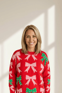 
fiery red women's christmas sweater with bow and pearl detail elegant festive holiday style for a flattering fit made for easy styling and wardrobe