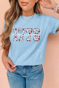 Light Blue Floral Print Relaxed Fit T-Shirt for Women - Comfortable America 1776 Graphic Tee for Casual Everyday Style