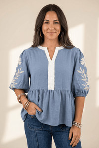 women's myosotis blue embroidered v-neck babydoll blouse made for easy styling and wardrobe coordination, with premium-like structure and finish. with
