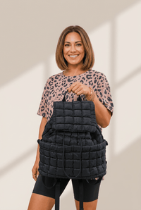 Women's Quilted Puffer Flap Backpack in Onyx Black