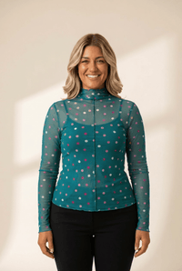 Women's Teal Polka Dot Mesh Mock Neck Top with Cami Lining made for easy styling and wardrobe coordination, with premium-like structure and finish.