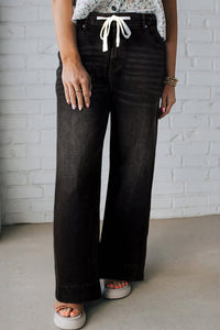 Women's Trendy Plus Size Black Acid Wash Jeans with Lace-up Detail for a Chic and Stylish Women's Outfit
