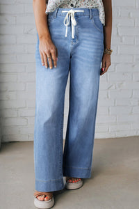 Women's Trendy Plus Size Women's Iceland Blue Acid Wash Jeans with Lace-up Detail for a Flattering Fit and Stylish Contrast