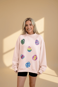 Women's Sequin Easter Egg Mock Neck Sweatshirt in Apricot Pink