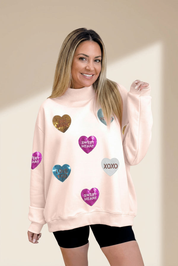 Women's Sequin Heart Mock Neck Sweatshirt in Apricot Pink