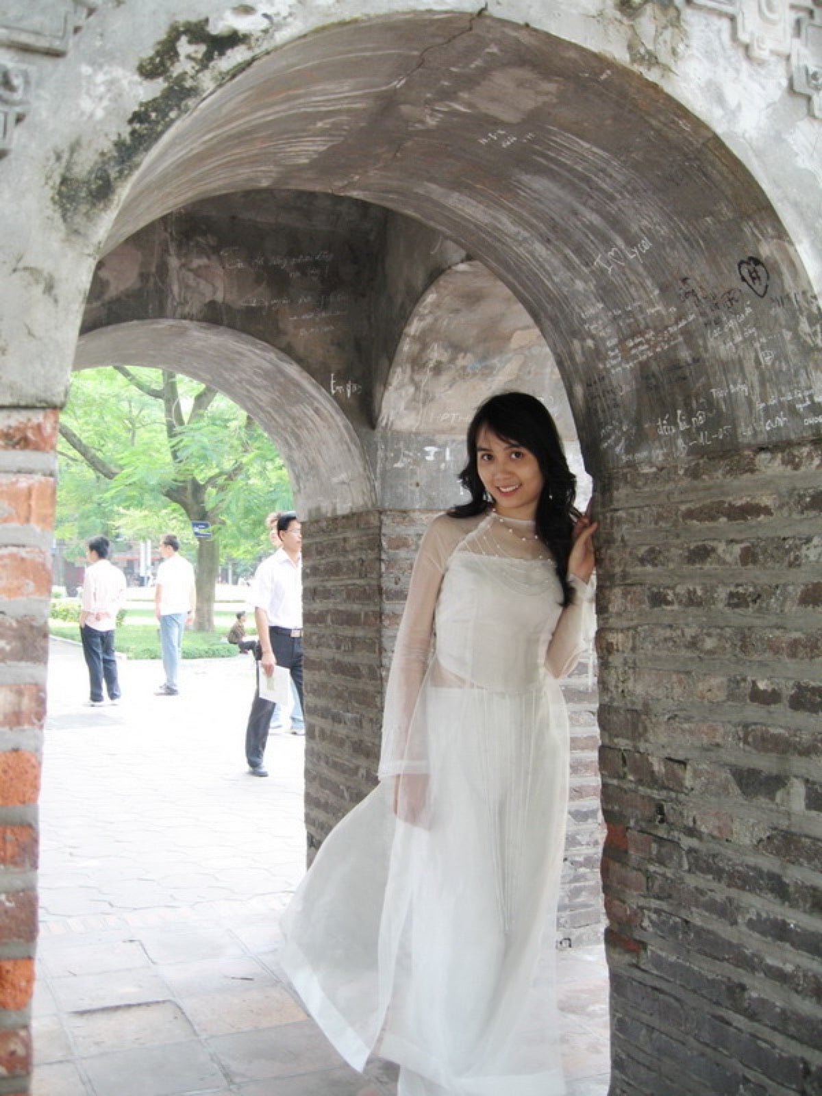 Ao dai silhouette fitted tunic flowing trousers dress.