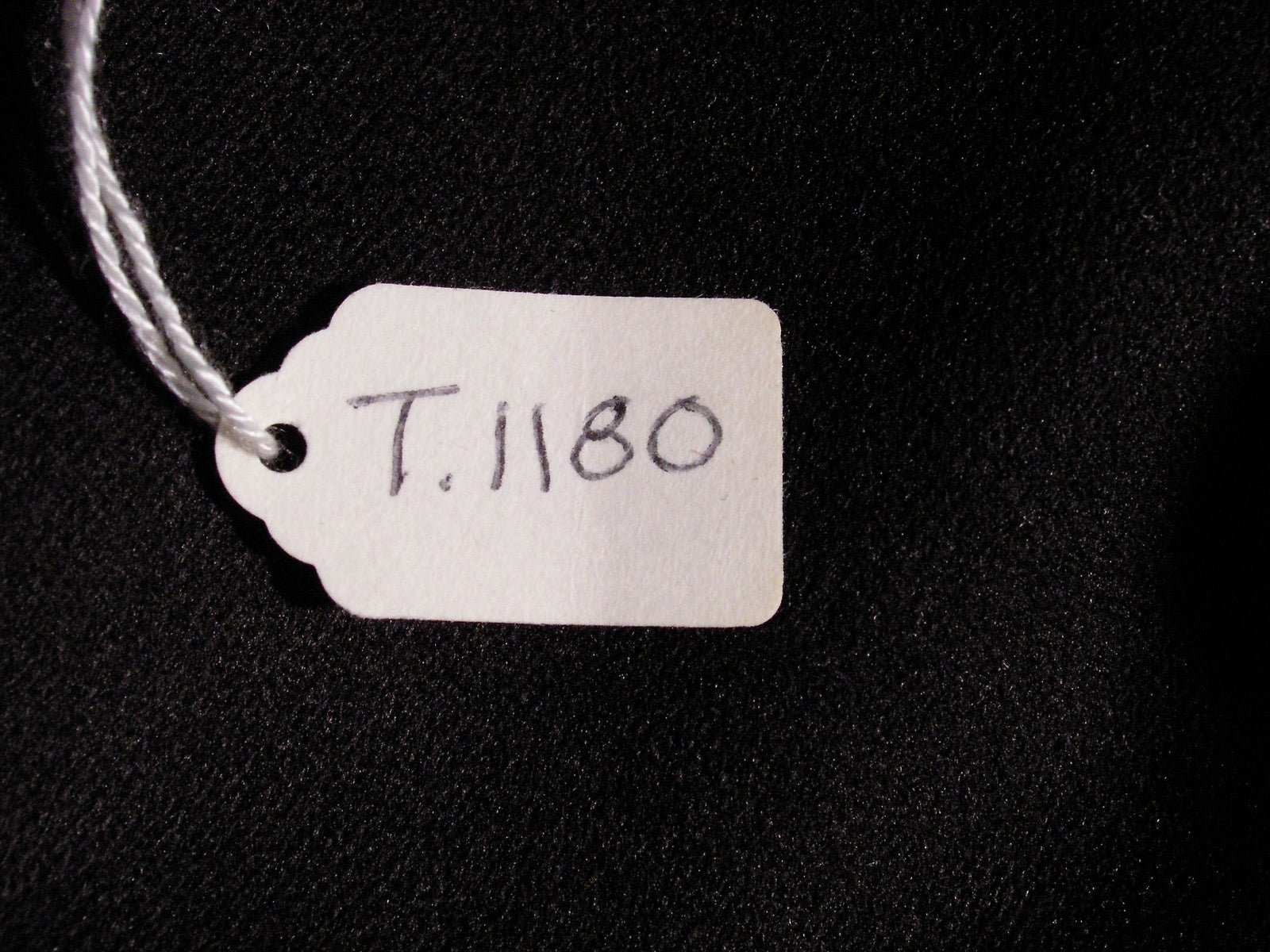 Coat with back vent opening at center hem panel.