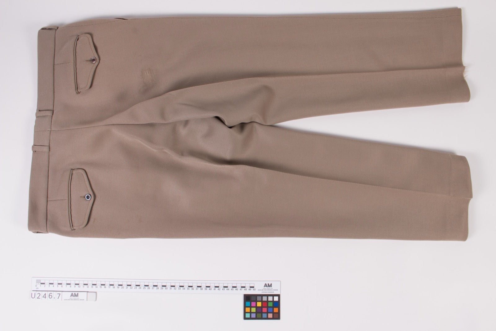 Trousers with belt loops at waistband on hip garment zone.