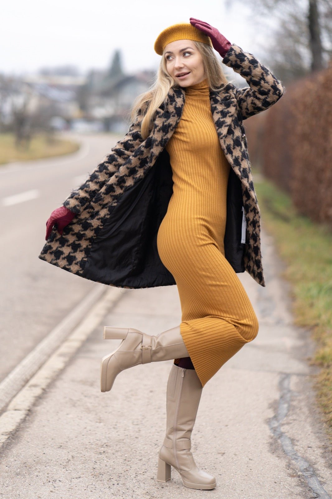 Color-block dress with contrasting amber and burgundy fabric panels.