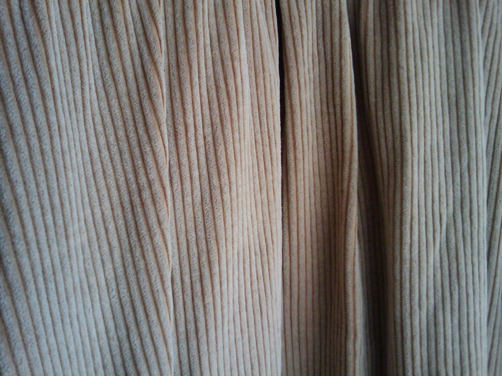 Corduroy fabric showing parallel cut-pile wales running lengthwise.