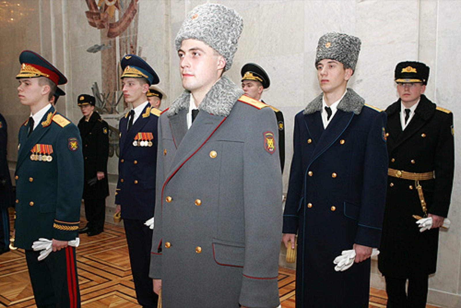 Russian military uniform with high standing Cossack-style collar.