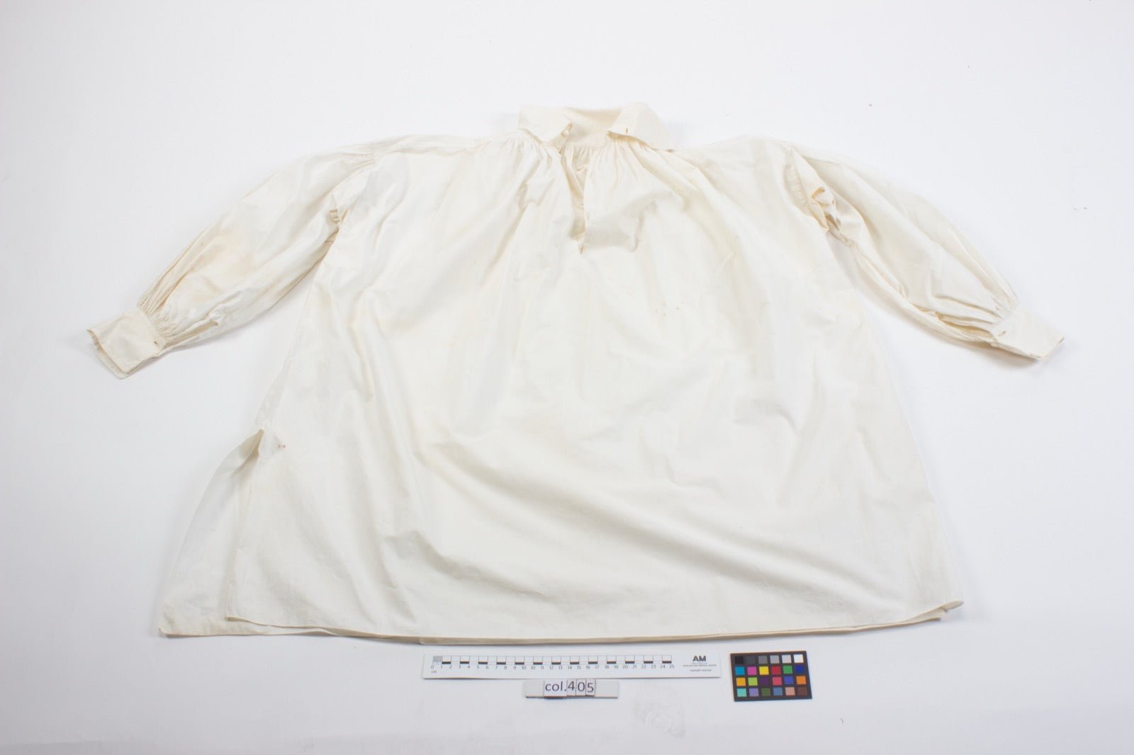 Dress shirt with cuff placket opening at sleeve end panel.