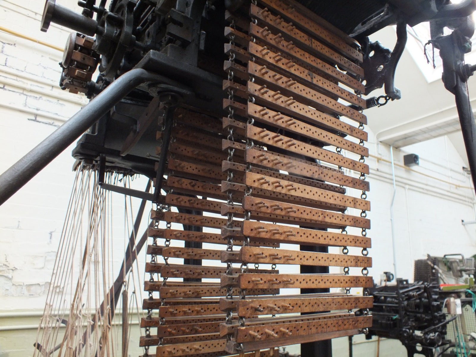 Industrial Hattersley loom showing the dobby pattern-selection head.