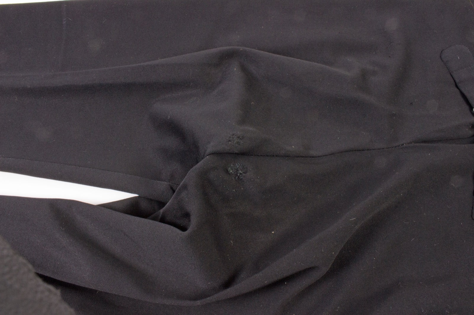 Dress trousers with fly shield panel at front opening.