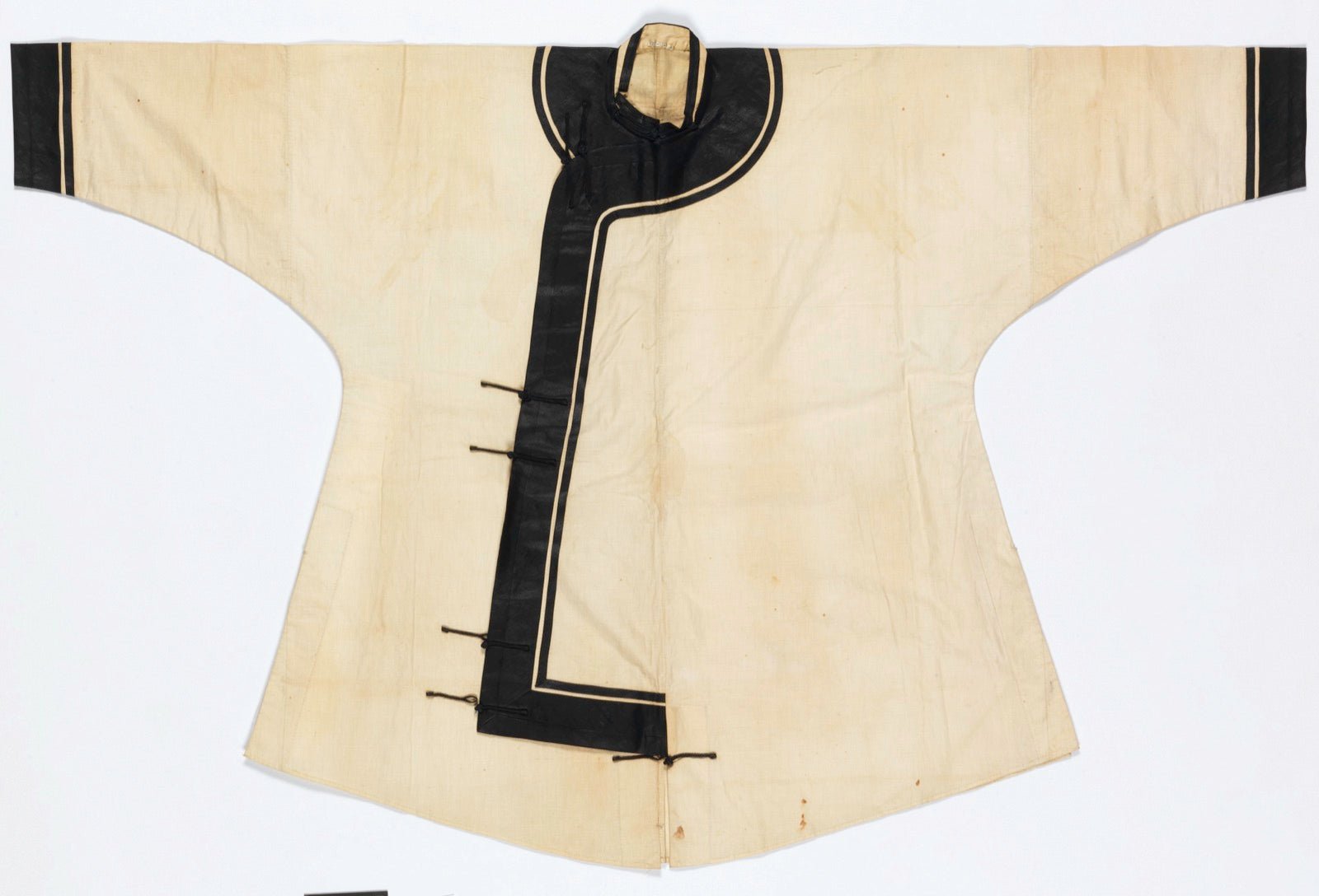 Chinese jacket with frog knot braided closures on front.