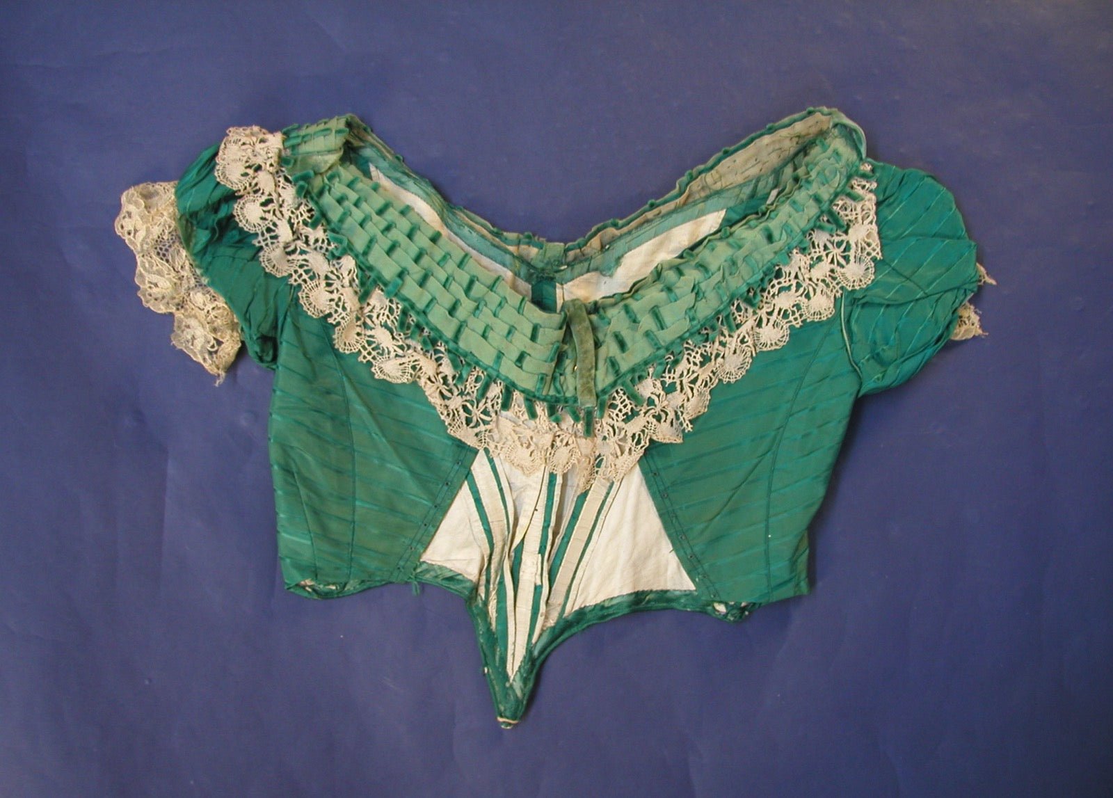 Evening dress with handkerchief hem panel points at uneven skirt edge.