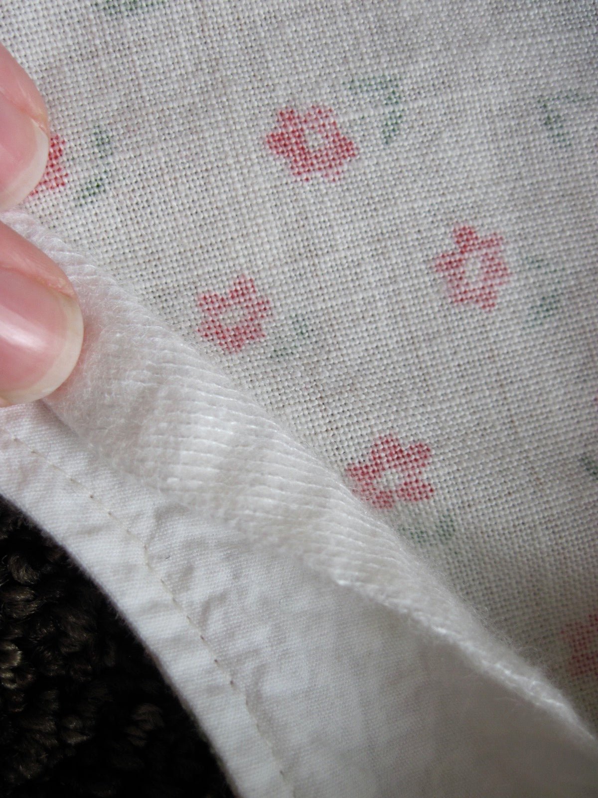 Hem facing with interfacing reinforcing garment hem edge.