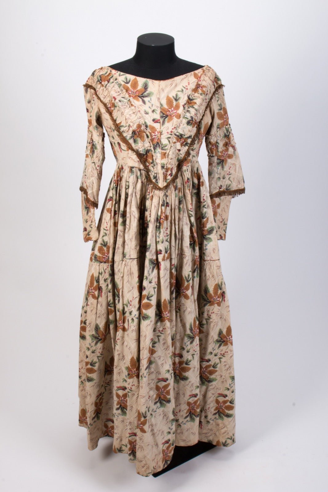 High-back evening dress with covered upper bodice at rear panel.